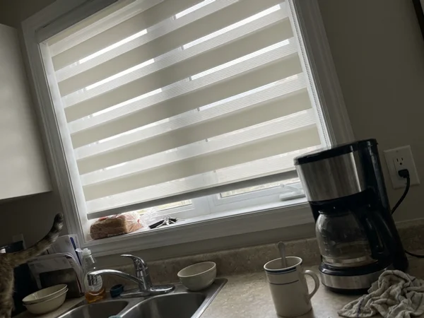 Zebra blind bands offset to let soft light into a Stittsville kitchen