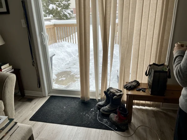 Fabric vertical blinds on a basement walkout patio door in Orleans