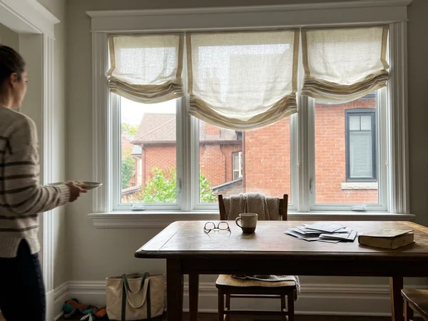 Hobbled linen roman shades in a Glebe dining room