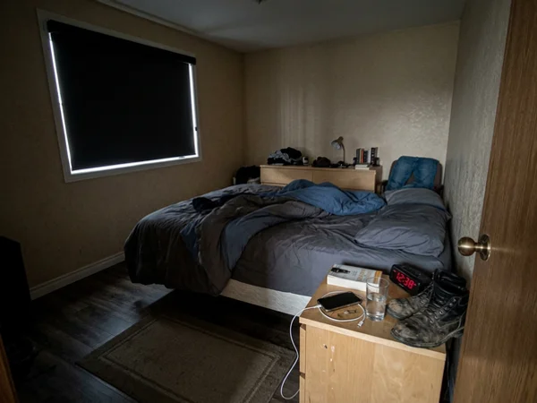Barrhaven bedroom with a charcoal blackout roller and cassette head closed at midday