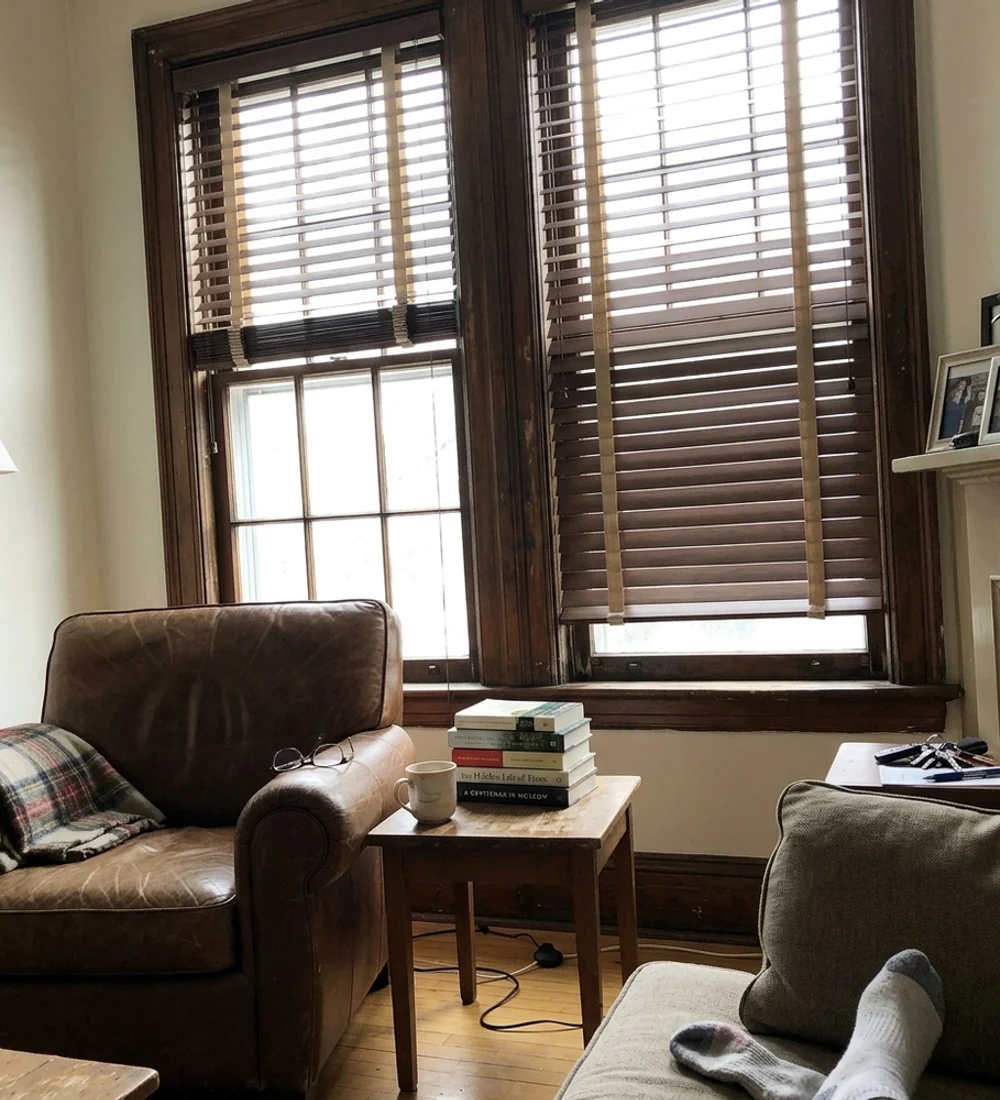 Walnut-stained real wood blinds with cloth tapes in a Glebe heritage living room